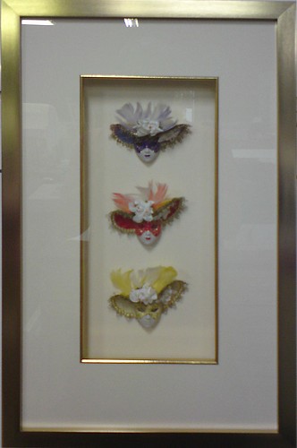 3 Small Masks Framed with a gold frame